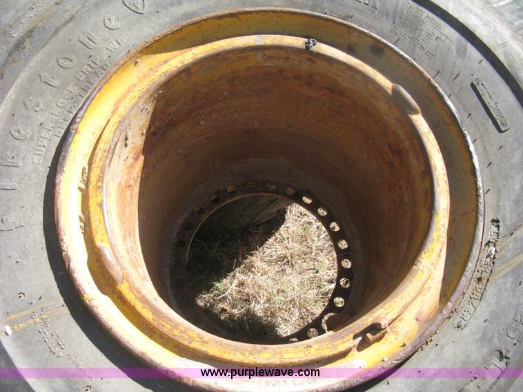 image for item H6322 (4) Caterpillar 980 loader tires and wheels