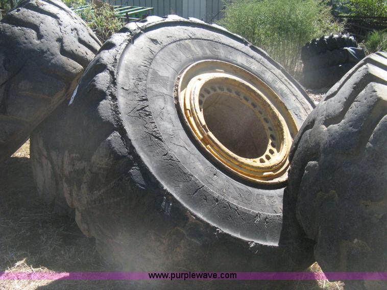 image for item H6322 (4) Caterpillar 980 loader tires and wheels