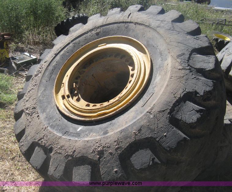 image for item H6322 (4) Caterpillar 980 loader tires and wheels