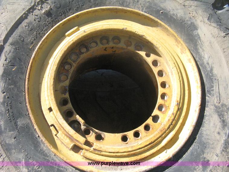 image for item H6322 (4) Caterpillar 980 loader tires and wheels