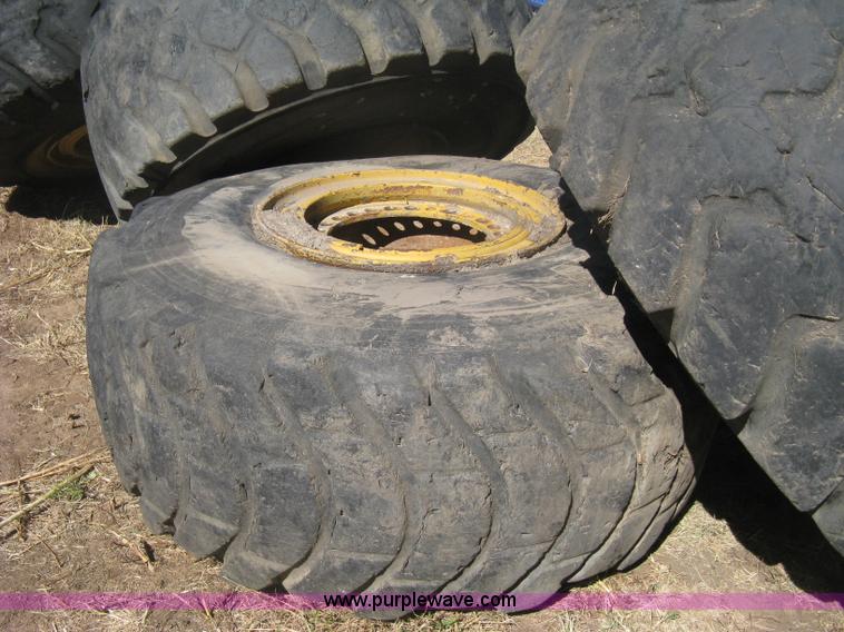 image for item H6322 (4) Caterpillar 980 loader tires and wheels