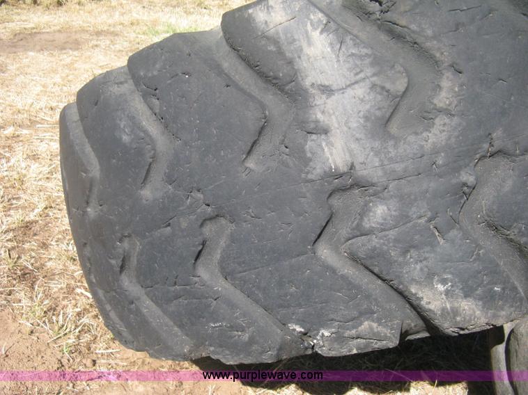 image for item H6322 (4) Caterpillar 980 loader tires and wheels