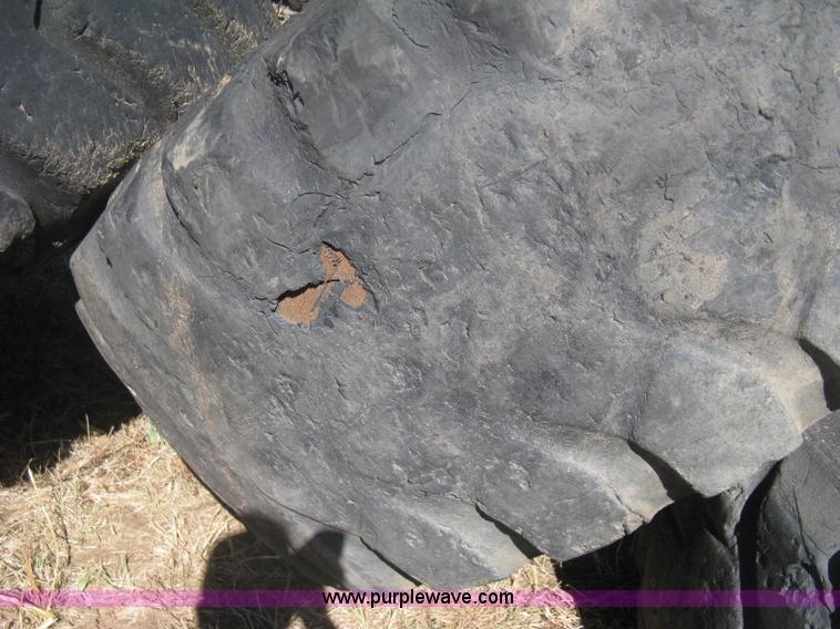 image for item H6322 (4) Caterpillar 980 loader tires and wheels