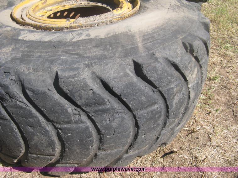 image for item H6322 (4) Caterpillar 980 loader tires and wheels