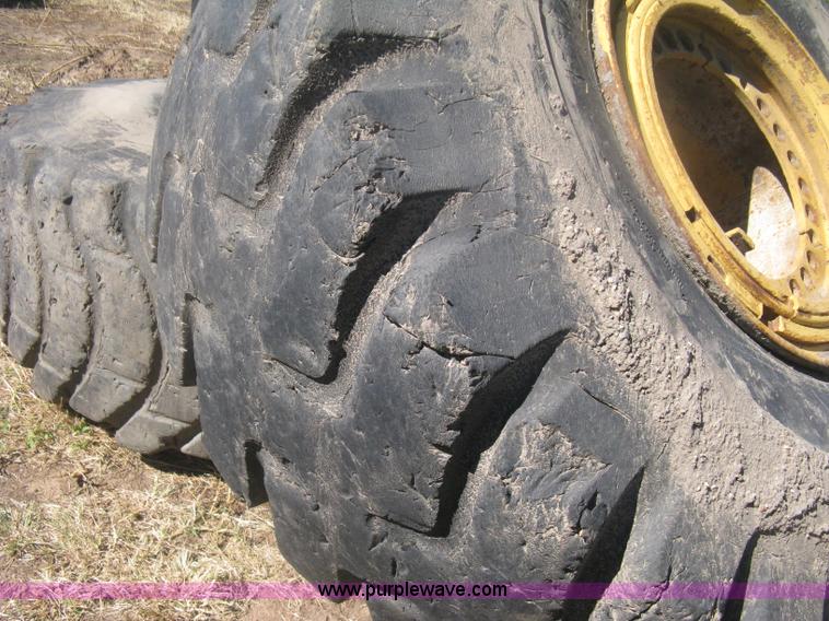 image for item H6322 (4) Caterpillar 980 loader tires and wheels