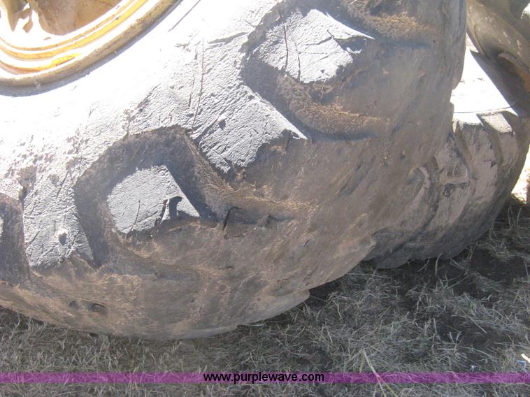 image for item H6322 (4) Caterpillar 980 loader tires and wheels