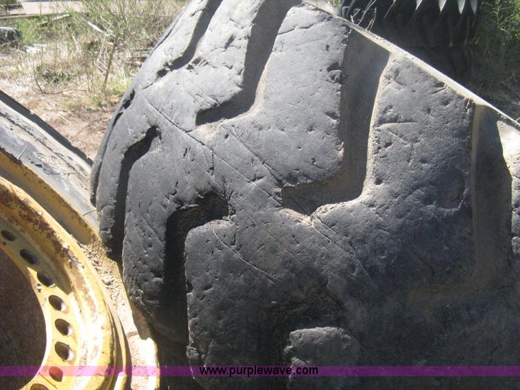 image for item H6322 (4) Caterpillar 980 loader tires and wheels
