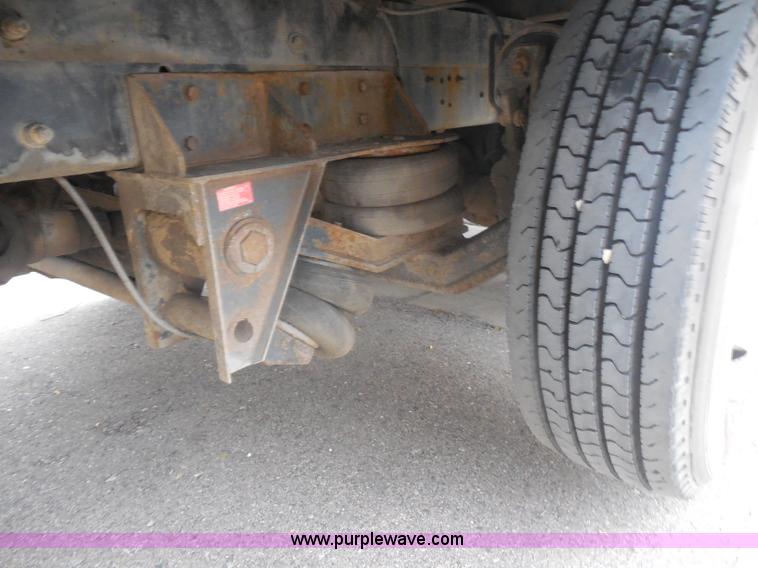 image for item I1322 2004 International DuraStar 4400 flatbed truck