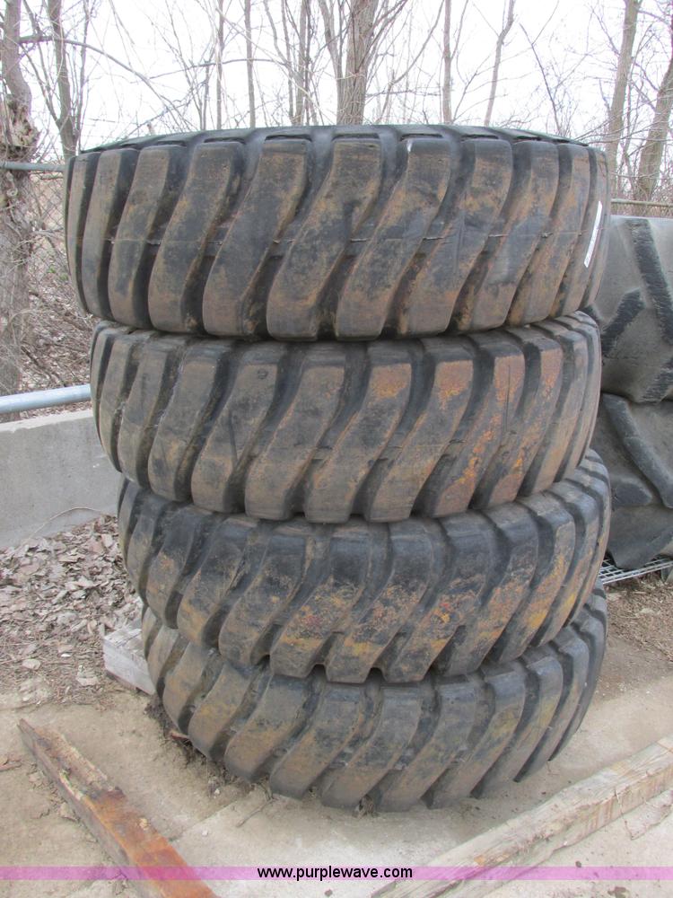 image for item AK9826 (4) 16-25 tires and wheels