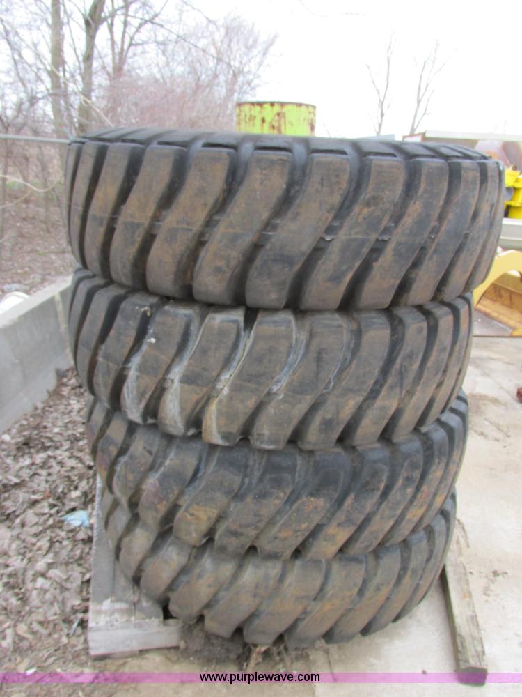 image for item AK9826 (4) 16-25 tires and wheels