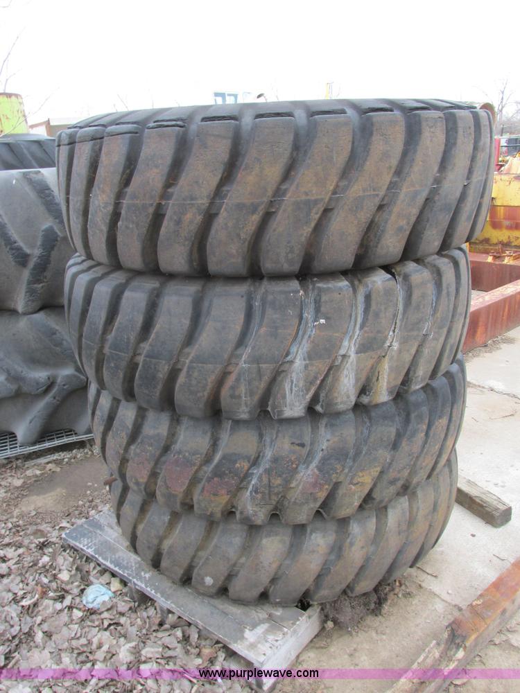 image for item AK9826 (4) 16-25 tires and wheels