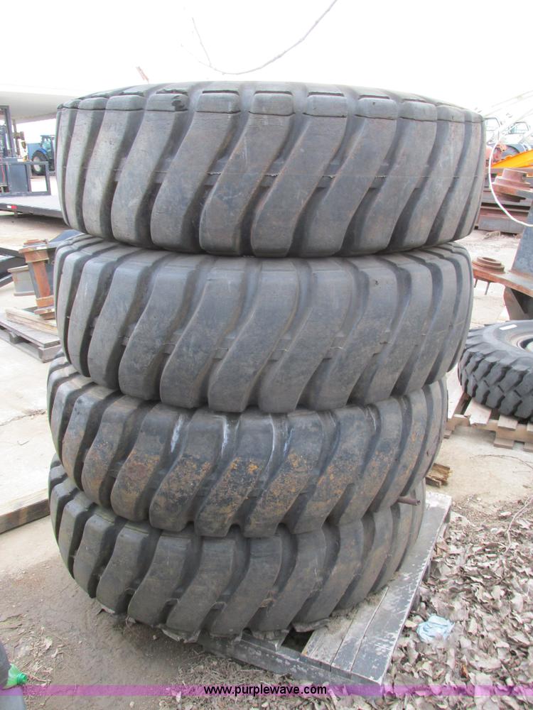 image for item AK9826 (4) 16-25 tires and wheels