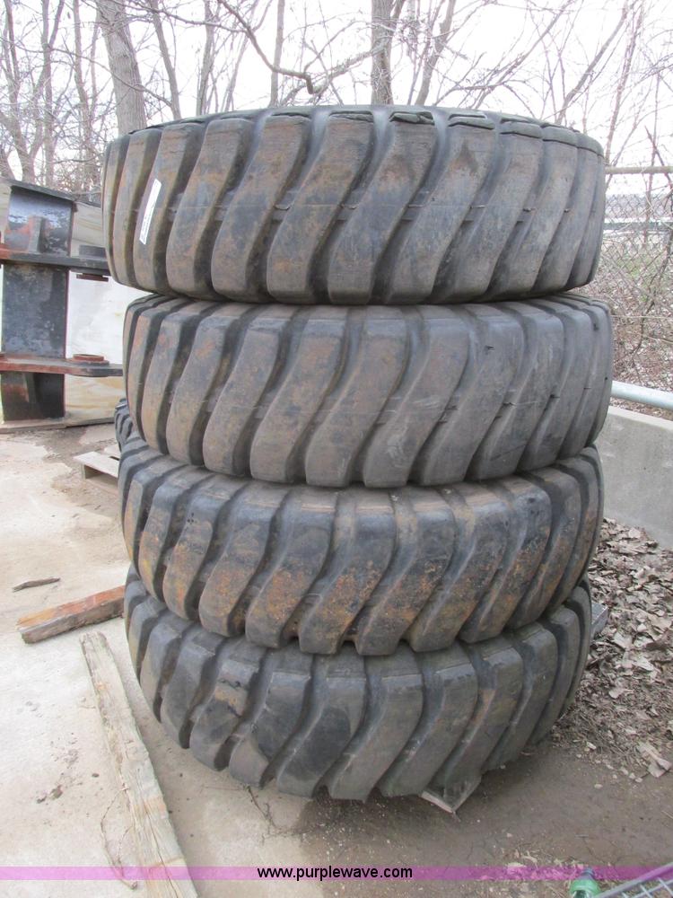 image for item AK9826 (4) 16-25 tires and wheels