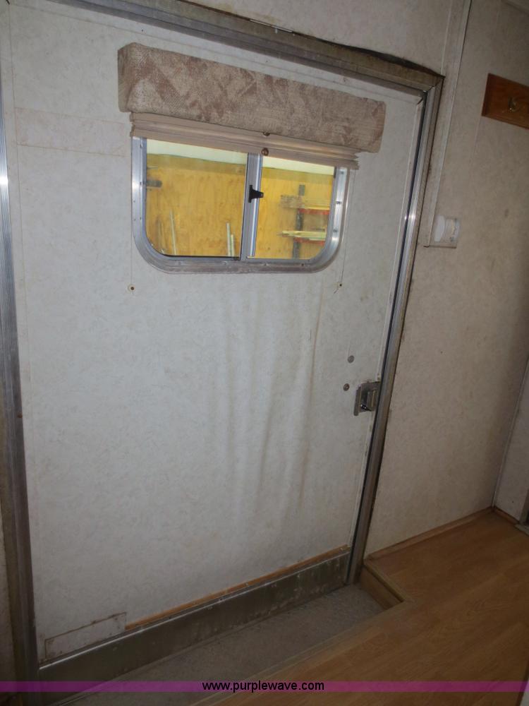 image for item F4402 2002 H&H 28' cargo trailer with living quarters