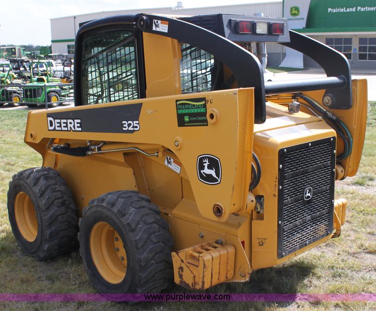 image for item G4226 John Deere 325 skid steer