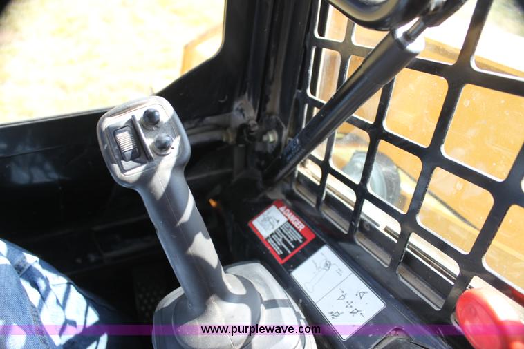 image for item G4226 John Deere 325 skid steer