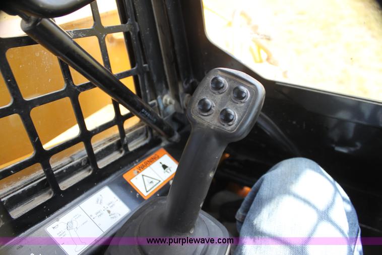 image for item G4226 John Deere 325 skid steer