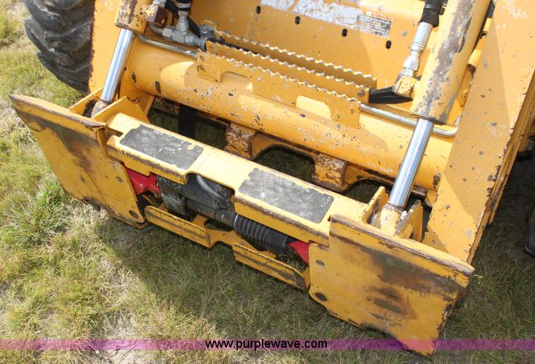 image for item G4226 John Deere 325 skid steer