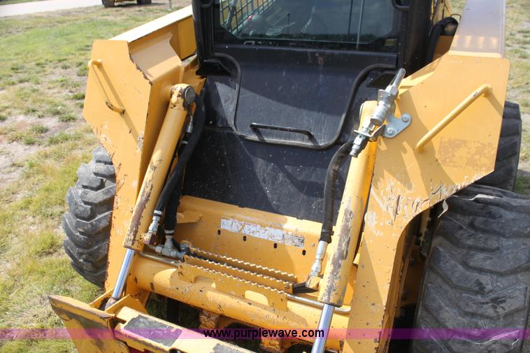 image for item G4226 John Deere 325 skid steer