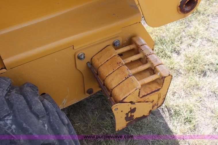 image for item G4226 John Deere 325 skid steer