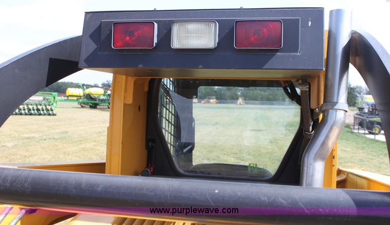 image for item G4226 John Deere 325 skid steer