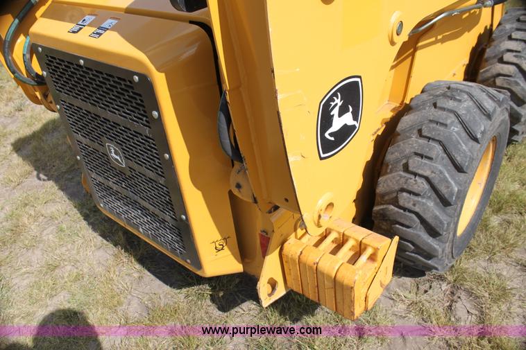 image for item G4226 John Deere 325 skid steer