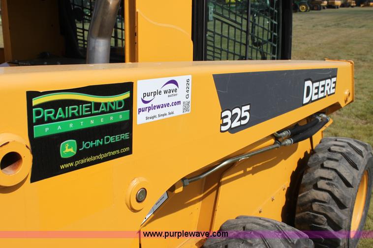 image for item G4226 John Deere 325 skid steer