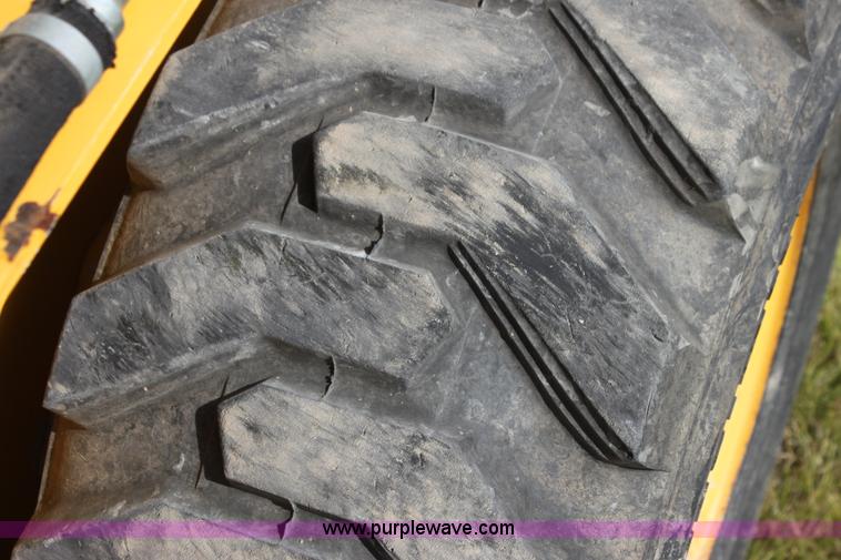 image for item G4226 John Deere 325 skid steer