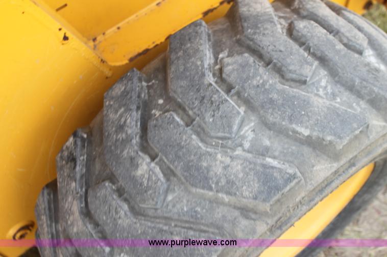 image for item G4226 John Deere 325 skid steer