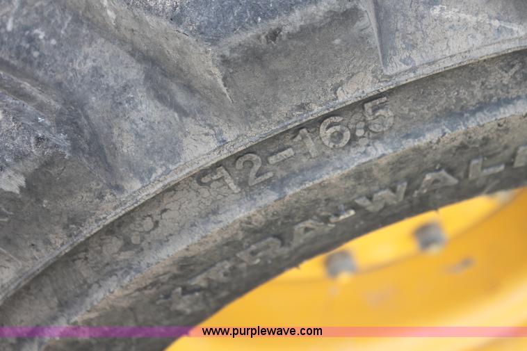 image for item G4226 John Deere 325 skid steer