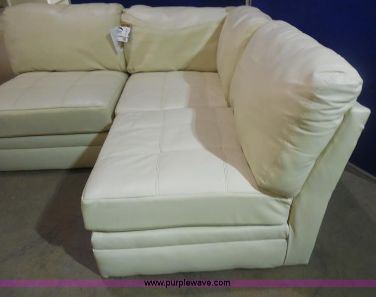 Ashley Furniture white leather sectional in Manhattan, KS Item I1307 sold Purple Wave