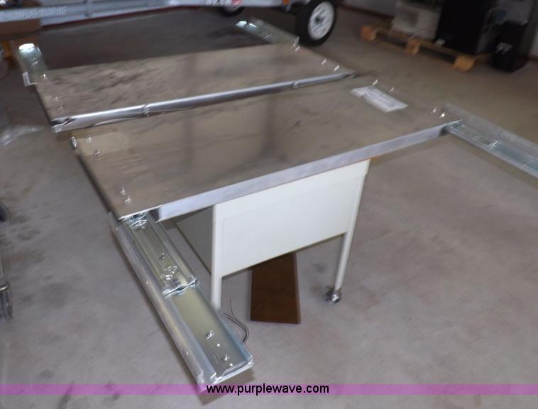 image for item I7505 (2) aluminum retractable shelf units