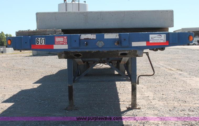 image for item H8439 1997 Fontaine LFTN-6-8048WSAK flatbed spread axle trailer