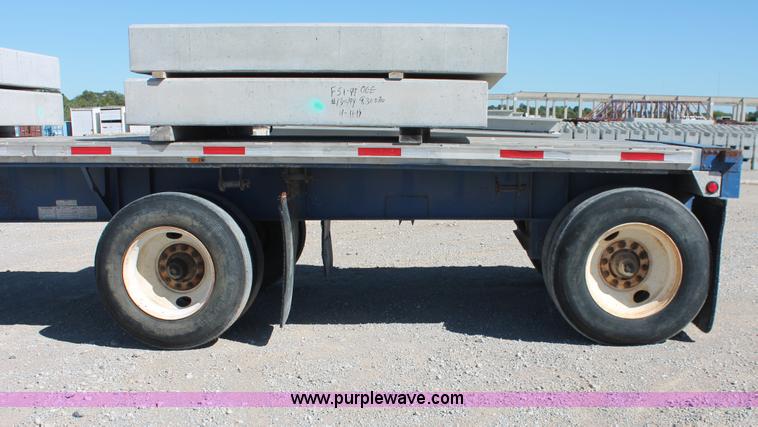 image for item H8439 1997 Fontaine LFTN-6-8048WSAK flatbed spread axle trailer