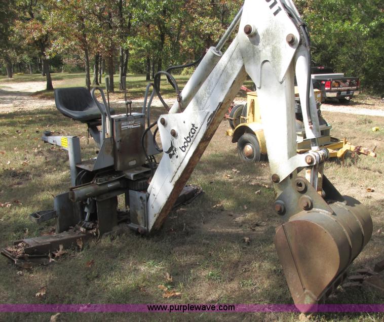image for item AN9166 Bobcat 911 hydraulic backhoe attachment