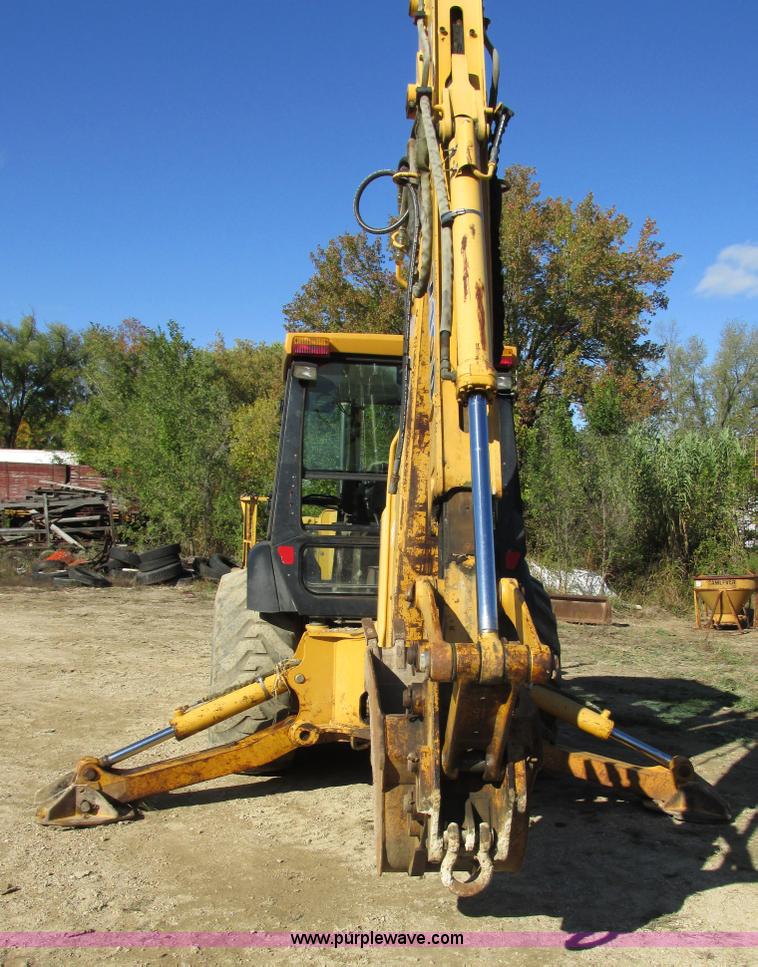 image for item E7409 2000 John Deere 710D backhoe