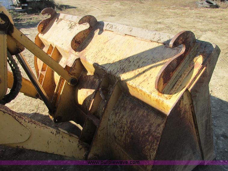 image for item E7409 2000 John Deere 710D backhoe