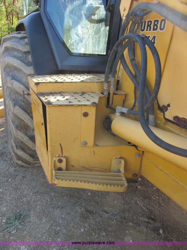 image for item E7409 2000 John Deere 710D backhoe