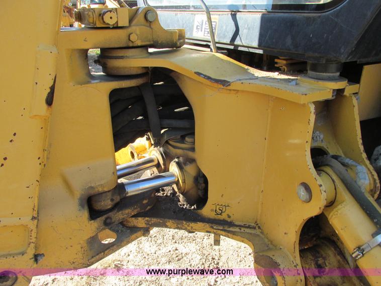 image for item E7409 2000 John Deere 710D backhoe
