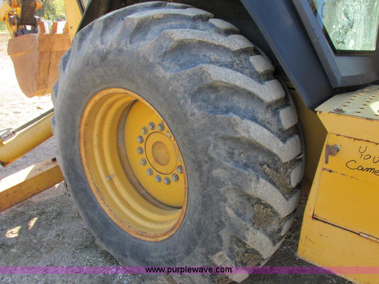 image for item E7409 2000 John Deere 710D backhoe