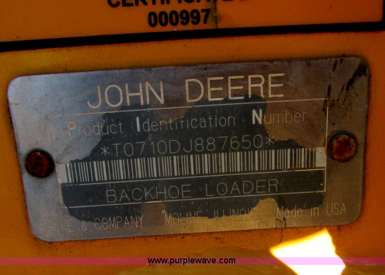 image for item E7409 2000 John Deere 710D backhoe