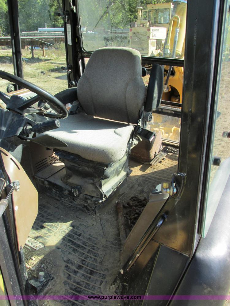 image for item E7409 2000 John Deere 710D backhoe