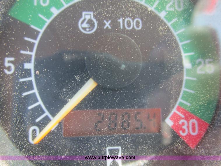 image for item E7409 2000 John Deere 710D backhoe