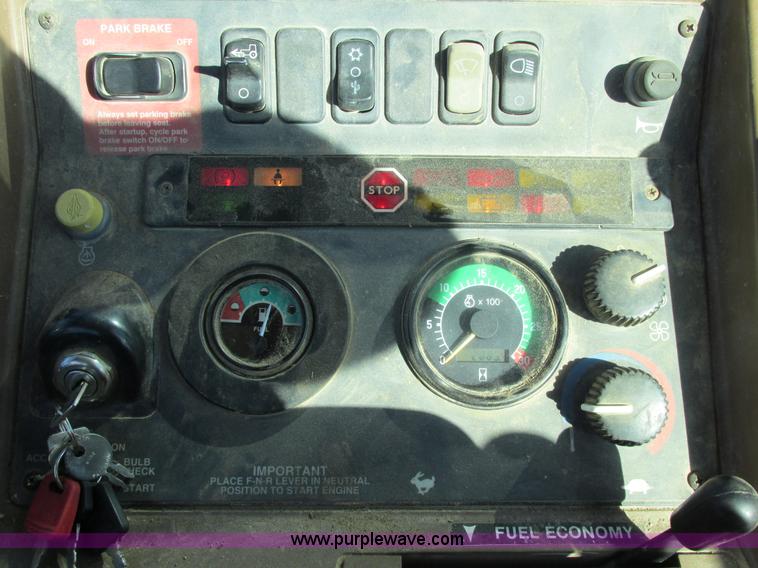 image for item E7409 2000 John Deere 710D backhoe