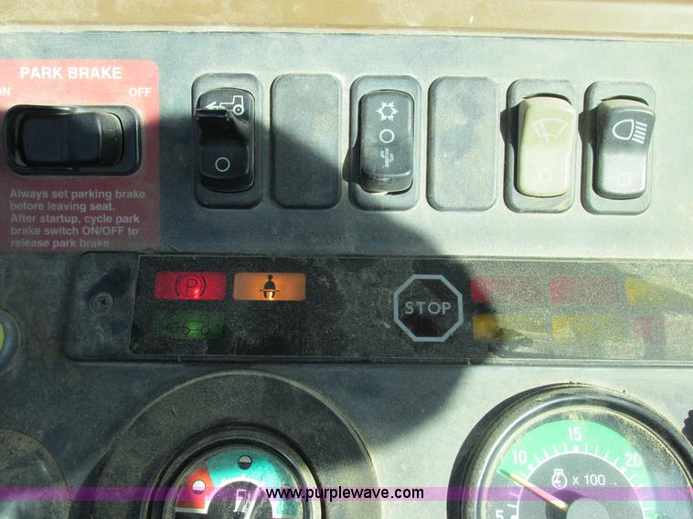 image for item E7409 2000 John Deere 710D backhoe