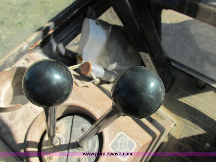 image for item E7409 2000 John Deere 710D backhoe