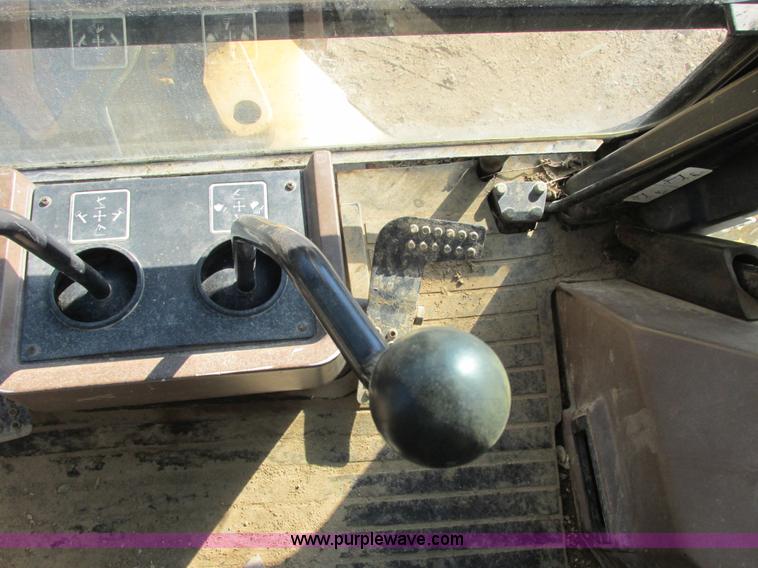 image for item E7409 2000 John Deere 710D backhoe