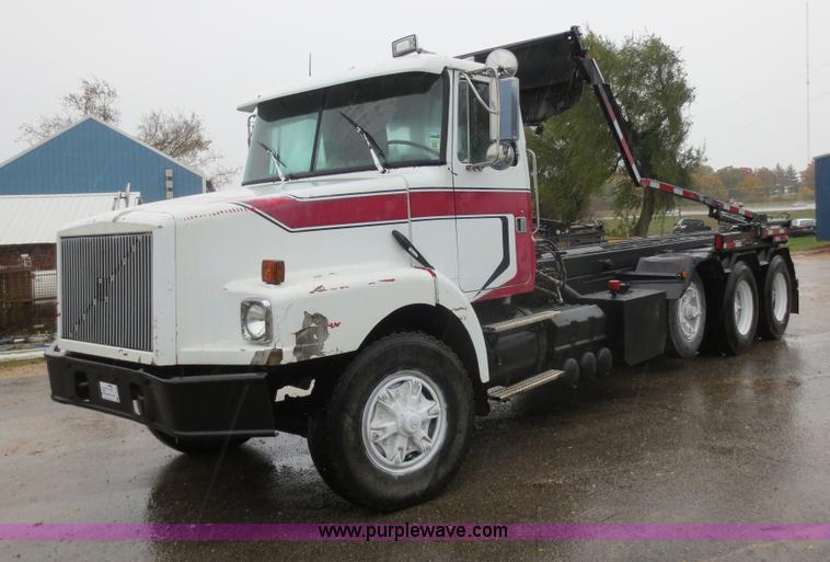image for item F8010 1996 Volvo WG roll off truck