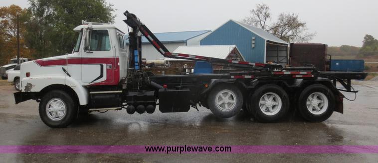 image for item F8010 1996 Volvo WG roll off truck