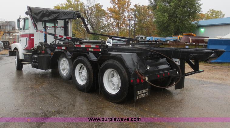 image for item F8010 1996 Volvo WG roll off truck